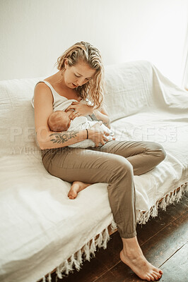 Buy stock photo Mother, baby breastfeeding and living room in a home with parent care, love and hug. Lounge, mama milk and newborn child in a family house with mom and young kid together with youth on a couch