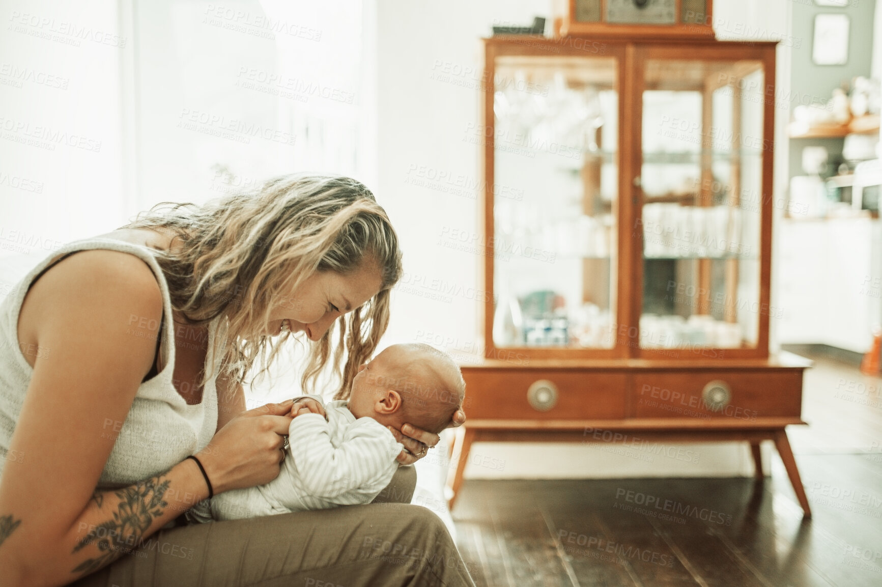 Buy stock photo Mother, holding baby and happy in home for love, care and bonding together. Mama, newborn smile and cute kid, infant or toddler in comfort, relax and playing while enjoying quality time in house.