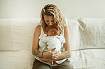 Mother, baby hug and living room in a home with parent care, love on a sofa. Maternity, mama relax and newborn child in a family house with mom and young kid together with youth on a lounge couch