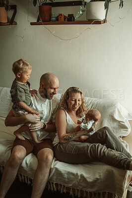Buy stock photo Parents, kids and a happy family on the sofa in the living room of their home together for bonding. Mother, father and children in the house with a baby and cute boy child in the lounge to relax
