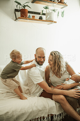 Buy stock photo Parents, children and a playful family on the sofa in the living room of their home together for bonding. Mother, father and kids in the house with a baby and cute boy child having fun in the lounge