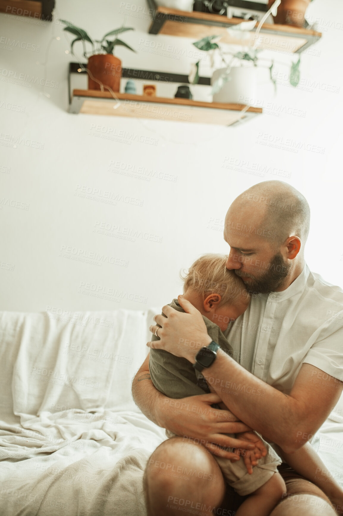 Buy stock photo Father, child and kiss in home for love, care and bonding together on sofa. Dad, boy and hug sad kid for affection, tired or sick toddler sleeping in living room with parent on couch in house lounge.