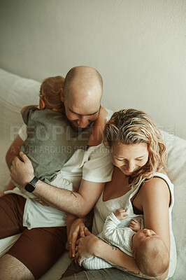 Buy stock photo Children sleep, parents and bonding in living room, love and care at home, relationship and relax on sofa. Childhood, parenting and woman with man, toddler and newborn on couch with family together