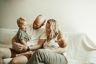 Buy stock photo Love, newborn and family on a couch, relax and quality time with happiness, bonding and support. Parents, kids or children on a sofa, loving together and home with joy, care and rest in a living room