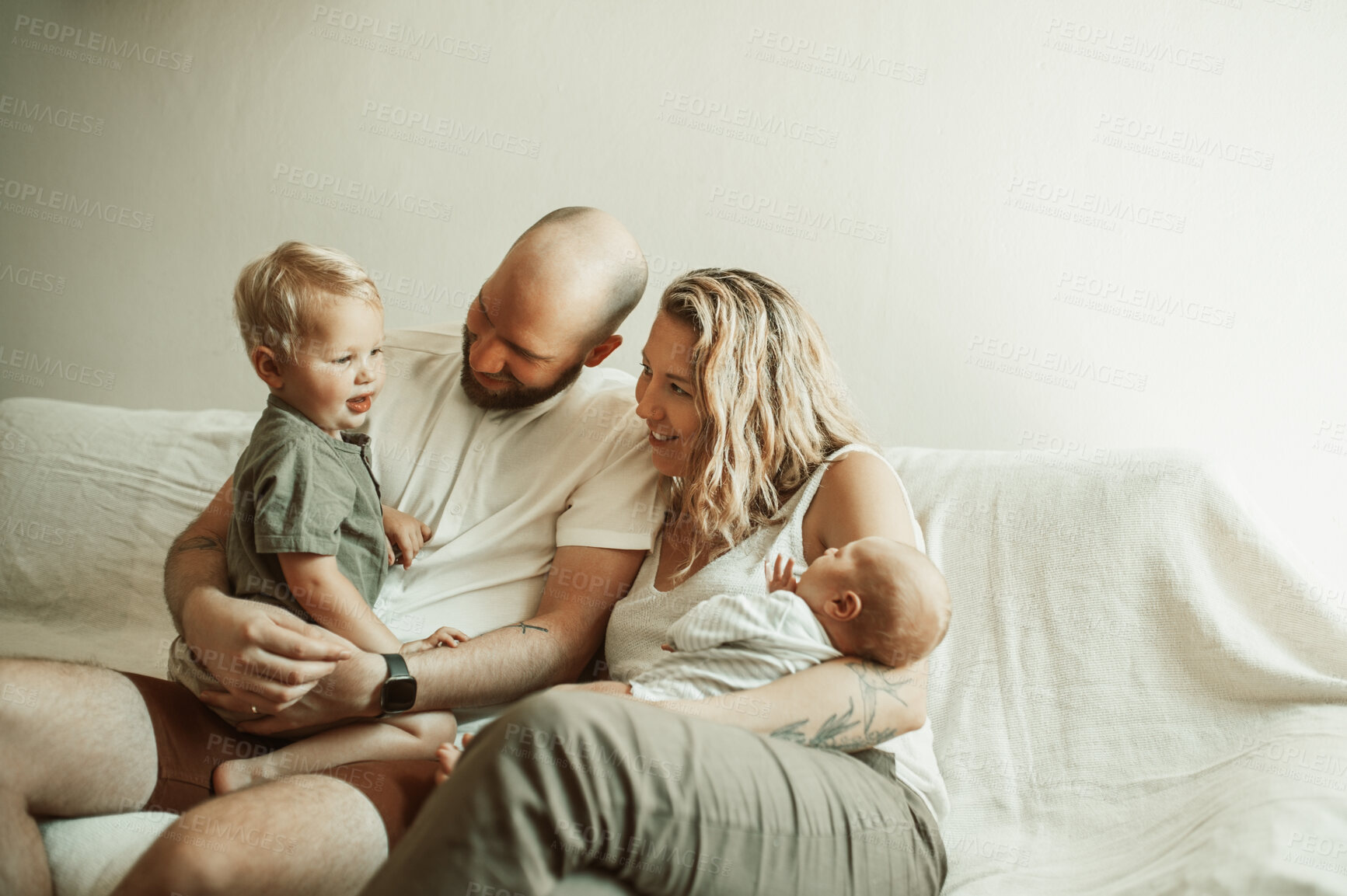 Buy stock photo Love, newborn and family on a couch, relax and quality time with happiness, bonding and support. Parents, kids or children on a sofa, loving together and home with joy, care and rest in a living room