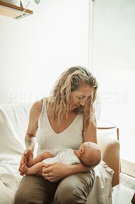 Buy stock photo Mother, holding baby in home and love, care and bonding together on sofa. Mama, newborn and cute kid, infant or toddler in comfort, relax and playing while enjoying quality time on living room couch.