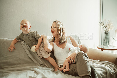 Buy stock photo Relax, mother and kids on a couch, play and happiness with quality time, cheerful and bonding. Family, female parent and mama with children, fun and loving together on a sofa, home and funny with joy