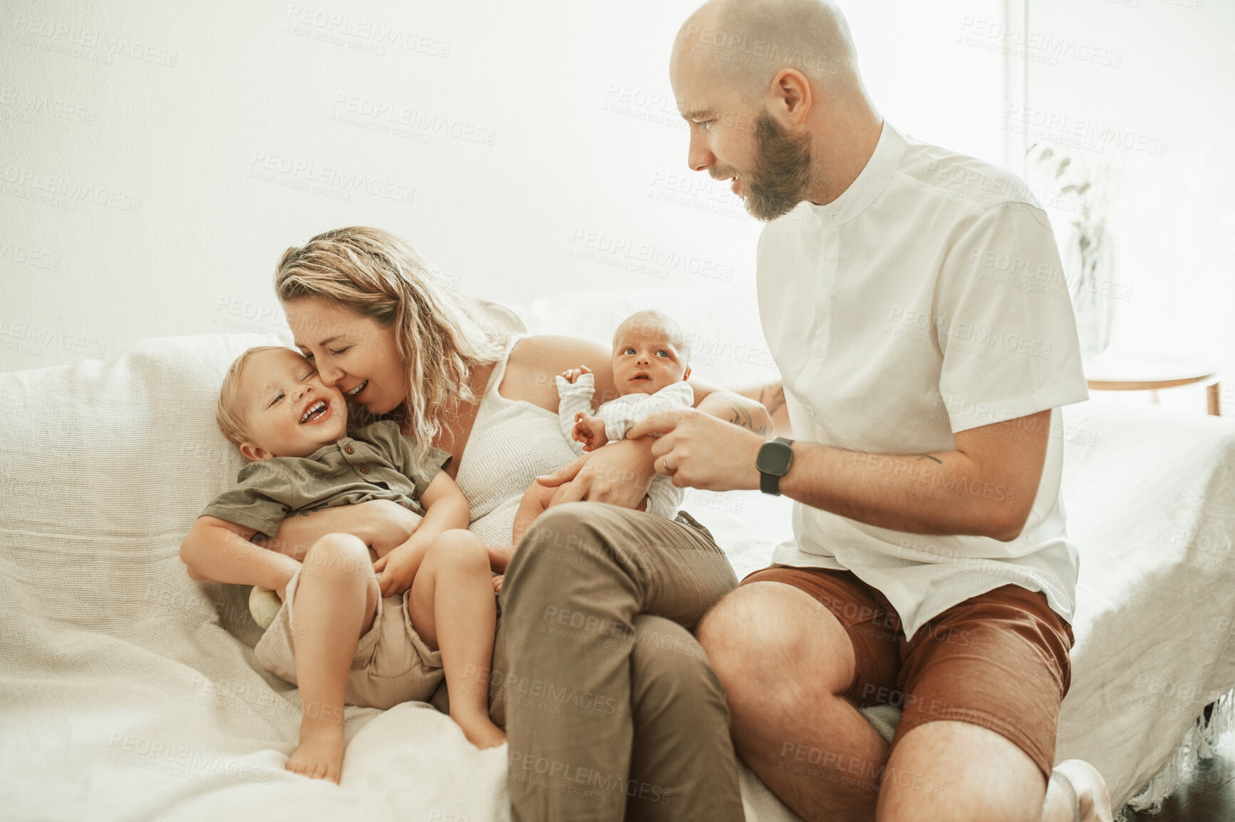 Buy stock photo Love, happy and family bonding on a sofa in the living room of their house with care and happiness. Excited, embracing and toddler child relaxing with mother, father and newborn baby sibling at home.