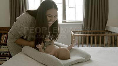 Buy stock photo Diaper, happy or mother with baby in home for care or bond together to nurture child development. Change, infant or single parent mom playing with a newborn for support, trust or love in family house