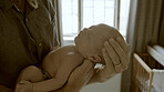 Parent, newborn and hands with baby as love, care or bonding in a home as affection together. Sleeping, support and person relax in bedroom with kid as family in house for childcare and comfort