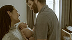 Couple, newborn and parents love baby as support, care or bonding in a home as fun, affection or childcare together. Happiness, dad and mother relax in bedroom with infant kid as family in house