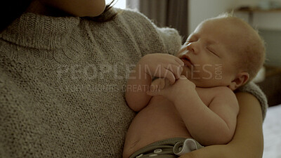 Buy stock photo Hands, newborn and parent with sleeping baby as care, love or bonding in a home as affection together. Infant, support and mom relax in bedroom with kid as family in house for childcare and comfort