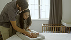 Bed, newborn and parents with sleeping baby and playing as love, care or bonding in a home as affection together. Happiness, dad and mother or couple relax in bedroom with kid as family in house