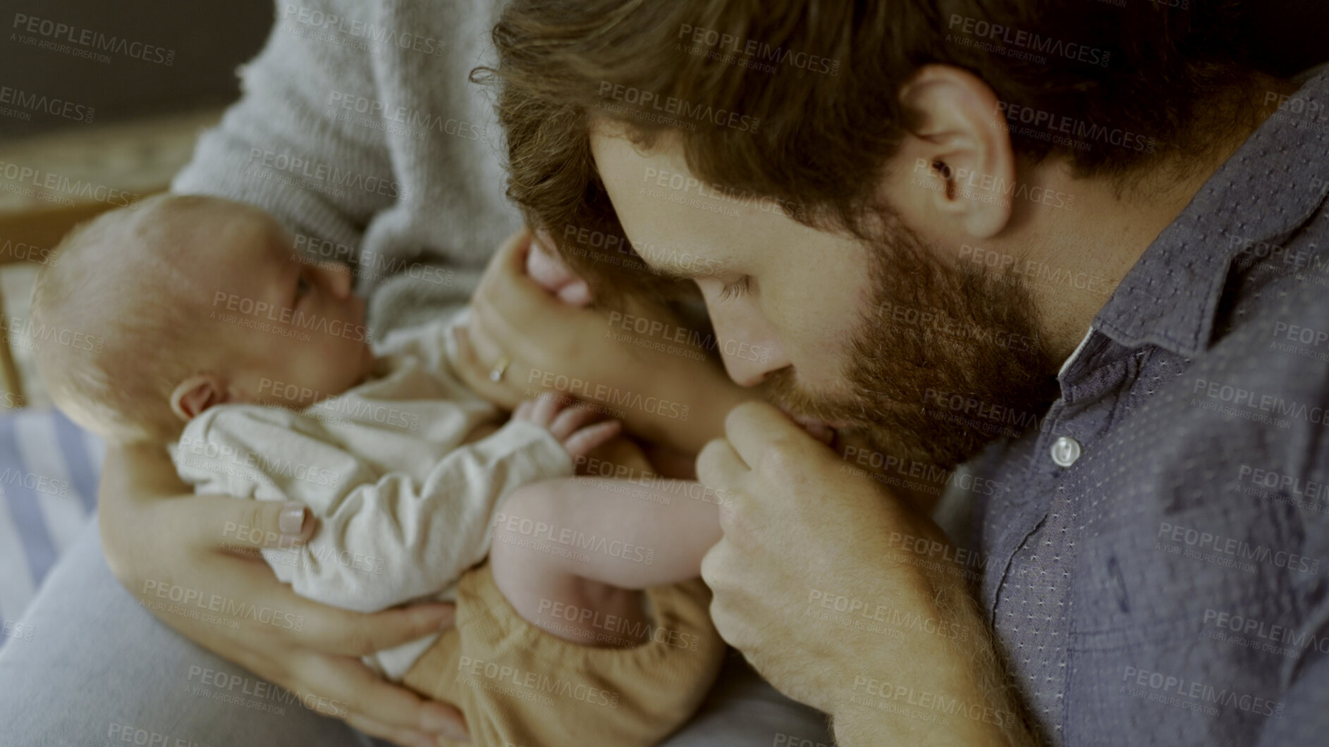 Buy stock photo Parents, newborn and father kiss baby and playing as love, care or bonding in a home as fun affection together. Happiness, dad and mother relax in bedroom kid toes or feet as family in house