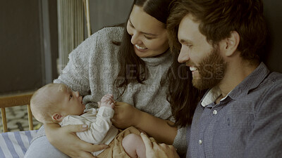 Buy stock photo Parents, newborn and happy couple with child for love, care or bonding in a home as fun or affection together. Happiness, dad and mother relax in living room with infant kid as family in house