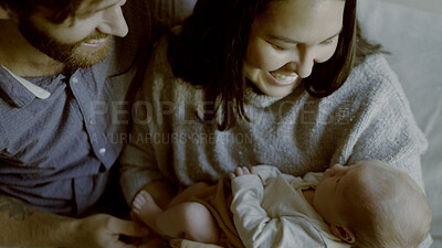 Buy stock photo Bond, care and parents holding baby in living room for nap time together at family home. Happy, smile and young mother and father with newborn, infant or child to sleep on a sofa in lounge of house.
