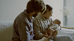 Parents, newborn and happy couple with baby and playing as love, care or bonding in a home for affection together. Happiness, dad and mother relax in living room with kid as family in house on sofa
