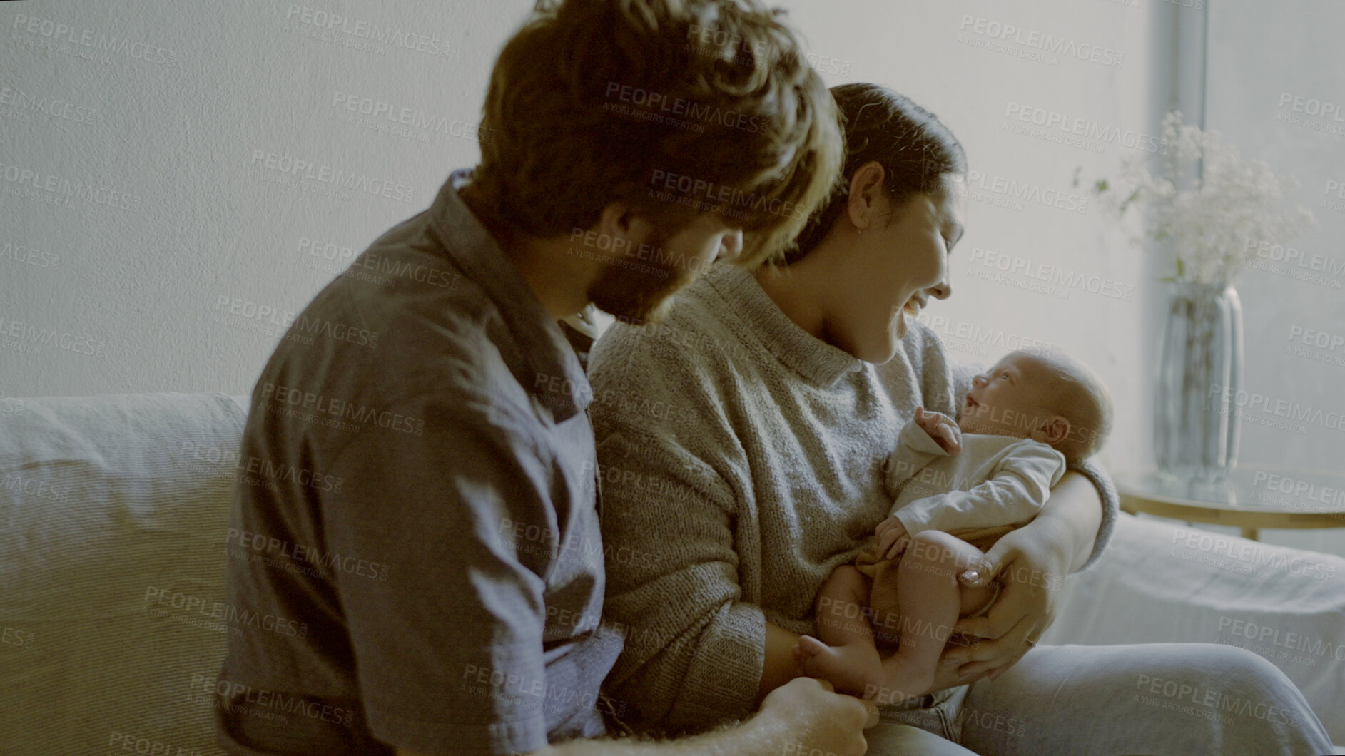 Buy stock photo Parents, newborn and happy couple with baby and playing as love, care or bonding in a home for affection together. Happiness, dad and mother relax in living room with kid as family in house on sofa