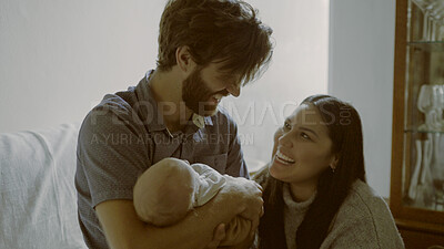 Buy stock photo Parents, mom or dad with a newborn in a happy family to bond together for child development. Living room, smile or proud father with mother or baby infant for love, safety or trust on sofa in home 
