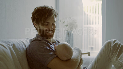 Buy stock photo Happy, hug or father with baby on sofa in home for care or bond together to nurture child development. Smile, newborn or single parent dad with an infant for support, trust or love in family house