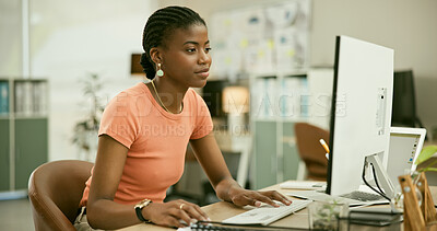 Buy stock photo Technology, reading and young black woman in the office doing research for creative project. Desktop, career and professional African female designer working on computer in the modern workplace.