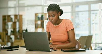Buy stock photo Copywriter, laptop and serious for office job, employee and busy for freelance career. Black woman, working and person for occupation, workplace and corporate for social media marketing strategy
