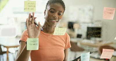 Buy stock photo Woman, sticky note or glass board with tablet for brainstorming, thinking and project management in office. Young person, smile and touchpad by scrum on wall, digital creative strategy and workplace