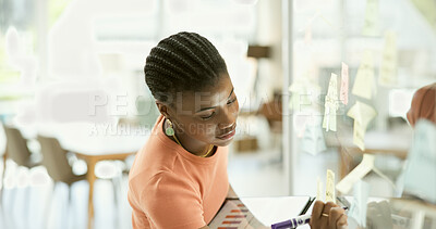 Buy stock photo Woman, tablet and glassboard with writing for brainstorming, project management and sticky note in office. Young person, agenda planning and scrum notes on wall, creative strategy and workplace idea