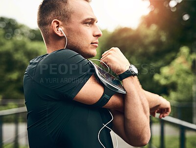 Buy stock photo Outdoor, stretching and man with fitness, nature and energy for warm up, challenge and training. Person in park, podcast or runner with exercise, listening to music and workout with wellness or radio