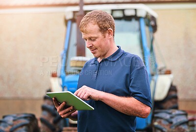 Buy stock photo Production, farmer and man with tablet by tractor for schedule, checklist and research on industry. Farming, website and male person with tech for agriculture, agro app and reading weather info