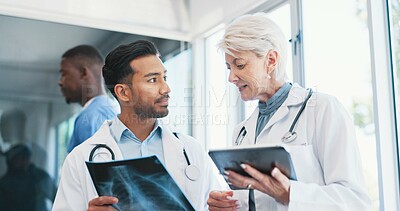 Buy stock photo Doctors, x ray and medical analysis in clinic, professional consultation and teamwork collaboration for patient results. Mature radiologist, tablet and researching or diagnosis, people and hospital