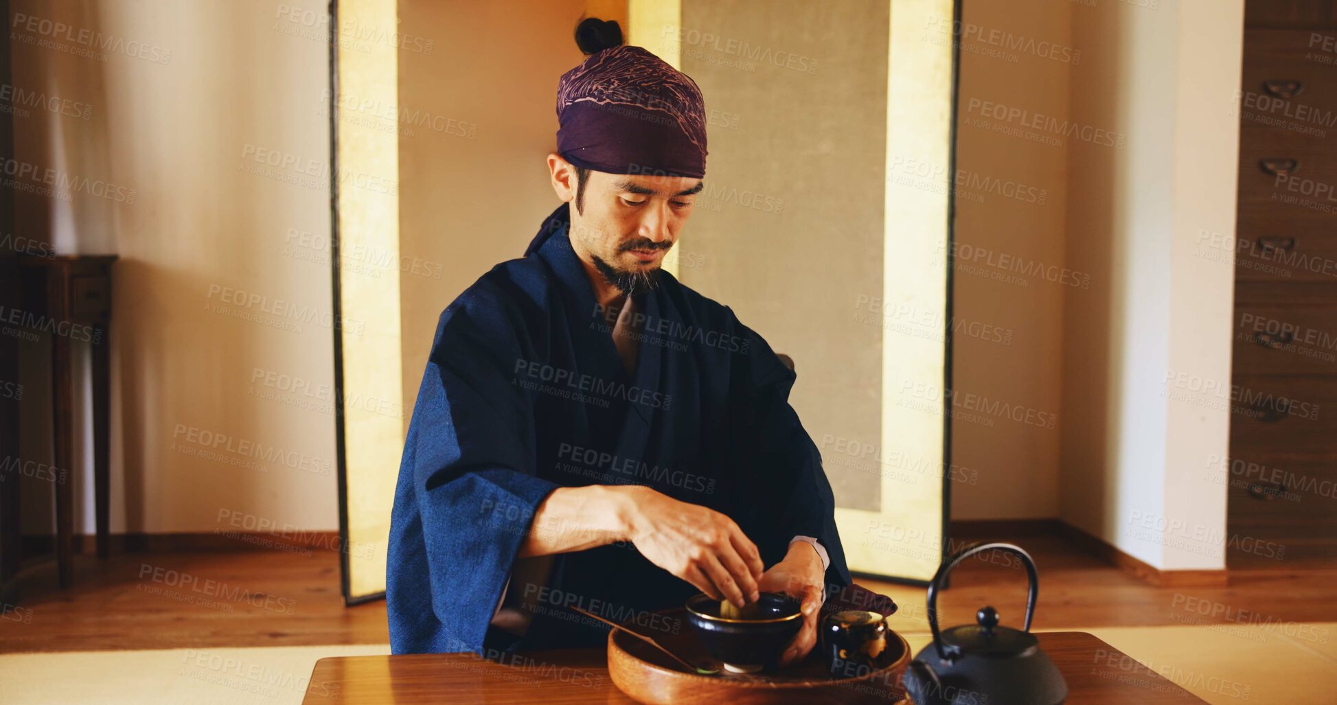 Buy stock photo Man, relax and tea ceremony for zen, culture and matcha in home with preparation in Japan. Male person, ritual and bowl for mindfulness, tradition and buddhism with spiritual, respect and harmony