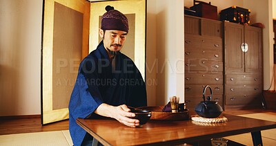 Buy stock photo Man, relax and tea ceremony for matcha, culture and tradition in home with preparation in Japan. Male person, ritual and bowl for mindfulness, zen and buddhism with spiritual, respect and harmony