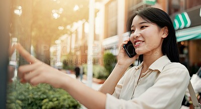 Buy stock photo Phone call, communication and woman in city for travel, vacation or weekend trip with direction board. Happy, cellphone and Japanese female person on mobile conversation for networking o holiday.