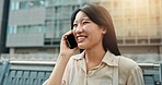 Phone call, happy and woman in city for travel, vacation or weekend trip with direction board. Communication, cellphone and Japanese female person on mobile conversation for networking o holiday.