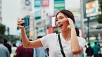 Japanese woman, selfie and hand sign in city with live streaming of vlogger for content creation. Video, social media and profile picture in Tokyo with travel love, vacation and app with post and web