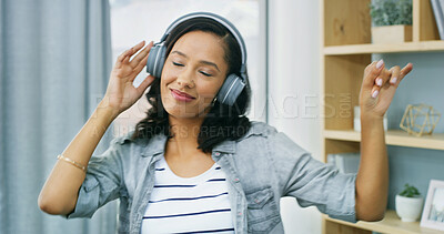 Buy stock photo Woman, dance and headphones with fun at house for listening to music, streaming audio and energy. Female person, technology and moving of rhythm, playlist sound and carefree freedom with subscription