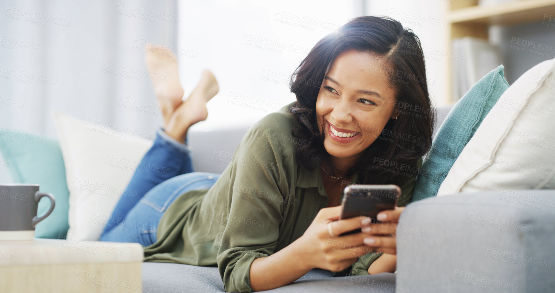 Buy stock photo Happy, thinking and woman with smartphone, laughing and funny videos on social media, relax and lounge. House, scroll and entertainment for person in living room, digital and comfortable in weekend