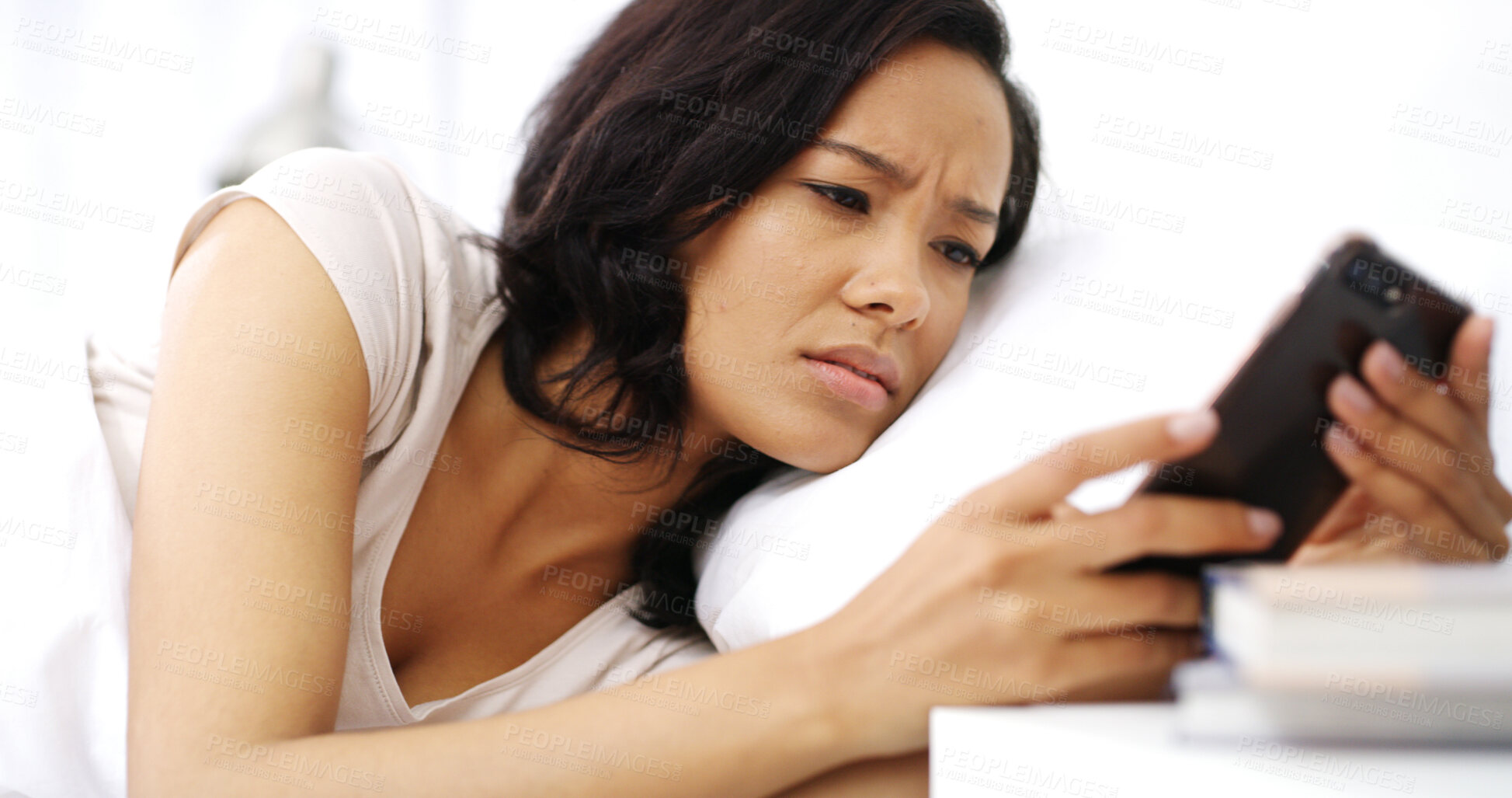 Buy stock photo Confused, phone and woman in bed in home on weekend morning with breakup text for relationship. Upset, mad and female person relaxing in bedroom with cellphone for bad news online in apartment.