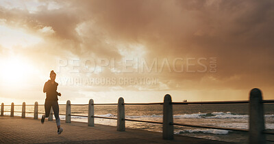 Buy stock photo Woman, running and outdoor sunrise for exercise, sports training and promenade for athlete performance. Female person, ocean workout and morning for marathon practice, space and speed challenge