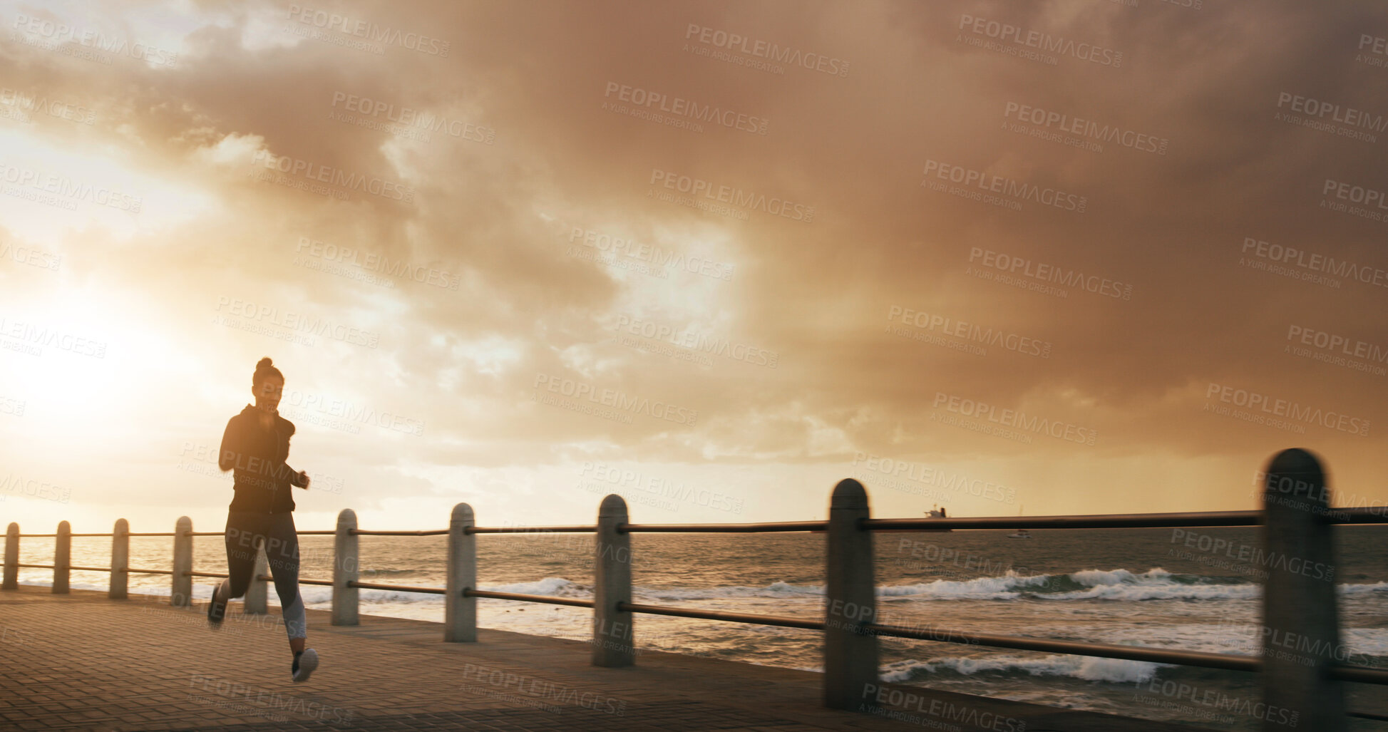 Buy stock photo Woman, running and outdoor sunrise for exercise, sports training and promenade for athlete performance. Female person, ocean workout and morning for marathon practice, space and speed challenge