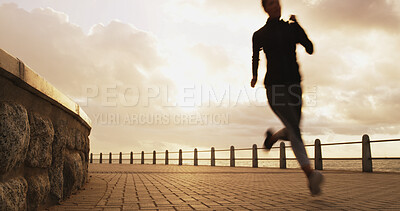 Buy stock photo Woman, sunset and running silhouette by ocean, promenade cardio and outdoor for weight loss. Female person, sports training and active athlete in nature, dusk challenge and fast motion blur by sea