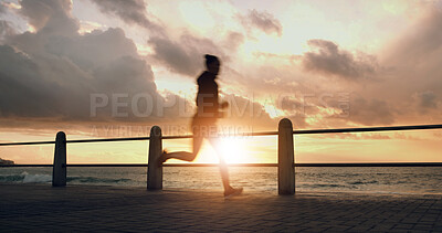 Buy stock photo Woman, sunset and running silhouette by sea, promenade cardio and outdoor for weight loss. Female person, sports training and active athlete in nature, speed challenge and practice routine by beach