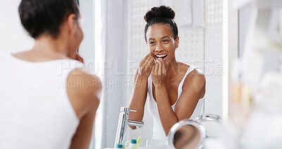 Buy stock photo Woman, mirror and flossing teeth in home, orthodontics and cosmetics in bathroom. Female person, oral health and string for grooming in reflection, cleaning mouth and self care or thread for plaque