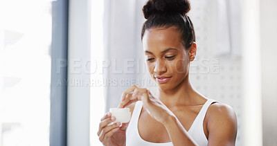 Buy stock photo Jar, woman and skincare cream in bathroom for glow, dermatology and morning routine for beauty. Lotion, moisturizer and girl apply cosmetics product, sunscreen or aesthetic treatment to shine in home
