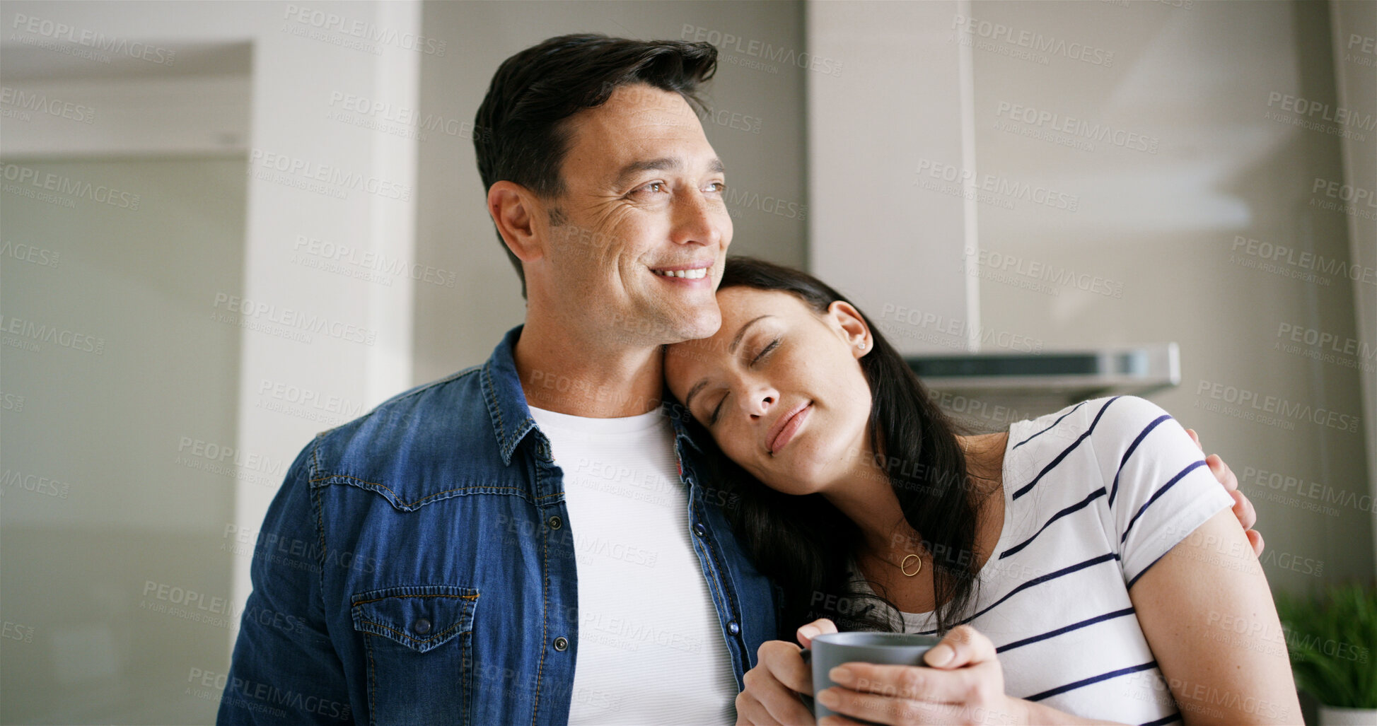 Buy stock photo Home, couple and tea with hug for bonding together, romantic moment and connection in marriage. House, happy man and woman with love embrace for affection, healthy relationship and coffee in morning