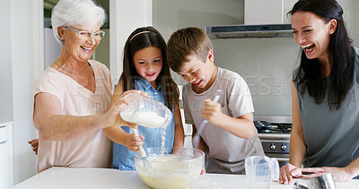 Buy stock photo Mother, grandmother and children baking in home with flour ingredients, laughing and helping with fun whisking. Women, kids and learning to cook in kitchen for development and cake recipe preparation