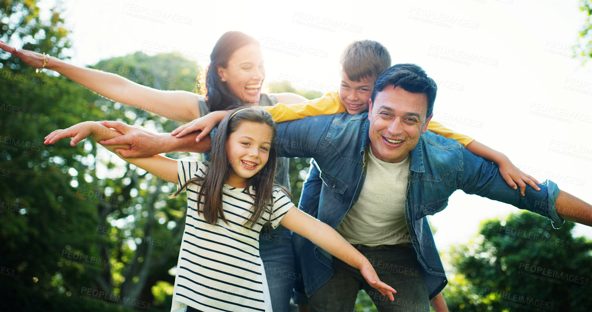 Buy stock photo Family, piggyback and outdoor flying for love, fantasy adventure and holiday park for bonding. Happy children, parents and nature for support with airplane games, portrait and together on vacation