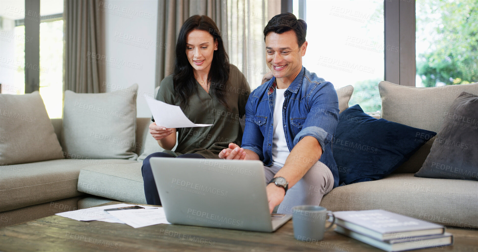 Buy stock photo Sofa, couple and documents with laptop for finance, track expenses and success for budget goals at home. House, woman and man with happiness for financial report, digital savings and mortgage bills