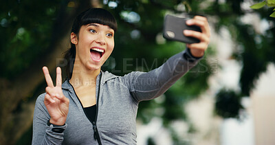 Buy stock photo Peace sign, fitness and selfie and woman in park for social media, profile picture and online post. Outdoors, nature and person with emoji take photo after workout, exercise and training for wellness